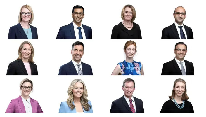 Twelve professional staff portraits with a consistent light background and framing